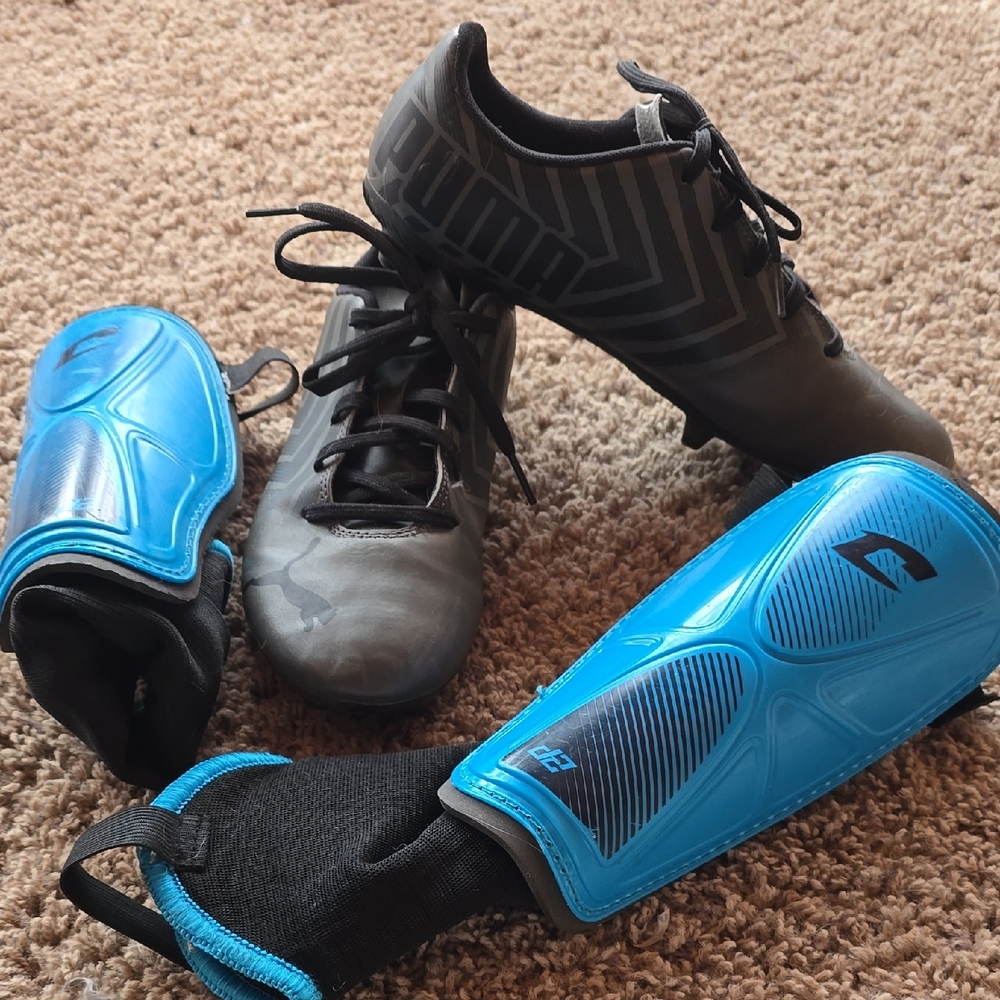 Puma Black Cleats with Blue Shin Guards